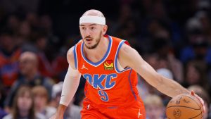 Oklahoma City Thunder guard Alex Caruso dribbles during the first half of an NBA basketball game against the Houston Rockets, Friday, Nov. 8, 2024, in Oklahoma City. (Nate Billings/AP)