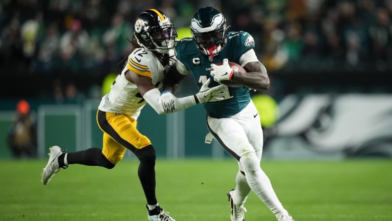 Philadelphia Eagles wide receiver A.J. Brown (11) runs with the ball as Pittsburgh Steelers cornerback James Pierre (42) tries to stop him during the second half of an NFL football game Sunday, Dec. 15, 2024, in Philadelphia. (Matt Slocum/AP)