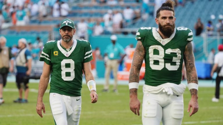 New York Jets quarterback Aaron Rodgers (8) and tight end Tyler Conklin (83) leave the field at the end an NFL game against the Miami Dolphins, Sunday, Dec. 8, 2024, in Miami Gardens, Fla. (AP/Lynne Sladky)