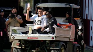 Las Vegas Raiders quarterback Aidan O'Connell (12) is taken off the field after an injury against the Tampa Bay Buccaneers during the second half of an NFL football game, Sunday, Dec. 8, 2024, in Tampa, Fla. (AP Photo/Chris O'Meara)