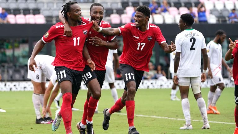 Trinidad and Tobago forward Levi García (11), Malcolm Shaw (19) and Andre Rampersad (17) celebrate after Saint Kitts and Nevis defender Jameel Ible scored an own goal during the second half of a CONCACAF Gold Cup soccer match, Sunday, June 25, 2023, in Fort Lauderdale, Fla. (AP/Lynne Sladky)