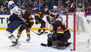 Vancouver Canucks goalie Thatcher Demko (35) watches the puck bounce back out of the net after allowing a goal to St. Louis Blues' Zack Bolduc, not seen, during the first period of an NHL hockey game in Vancouver, on Tuesday, December 10, 2024. (Darryl Dyck/CP)