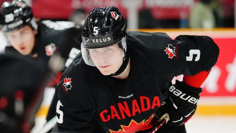 Canada's Oliver Bonk (5) lines up for a face off against Switzerland during first period IIHF World Junior Hockey Championship pre-tournament action in Ottawa on Thursday, December 19, 2024. (Sean Kilpatrick/CP)