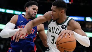 Milwaukee Bucks' Giannis Antetokounmpo tries to get past Detroit Pistons' Tobias Harris during the second half of an NBA basketball game Wednesday, Nov. 13, 2024, in Milwaukee. (AP Photo/Morry Gash)