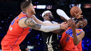 Oklahoma City Thunder centre Isaiah Hartenstein (55) and forward Jalen Williams (8) contest for a rebound with Milwaukee Bucks forward Bobby Portis (9) during the second half of the championship game in the NBA Cup basketball tournament Tuesday, Dec. 17, 2024, in Las Vegas. (Ian Maule/AP)