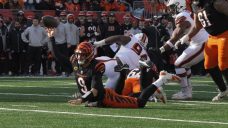 Burrow throws three TD passes as Bengals keep playoff hopes alive