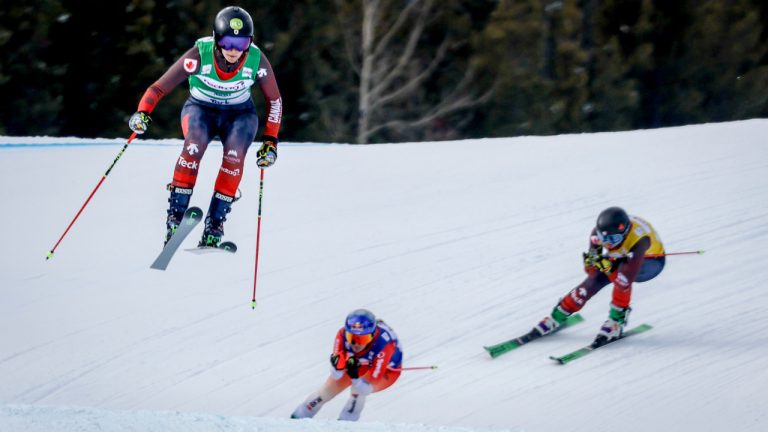 Canada's Hannah Schmidt, left, Switzerland's Fanny Smith, centre, and Canada's India Sherret ski during the women's semi-final of a World Cup ski cross event at Nakiska Ski Resort in Kananaskis, Alta., Sunday, Jan. 21, 2024. THE CANADIAN PRESS/Jeff McIntosh