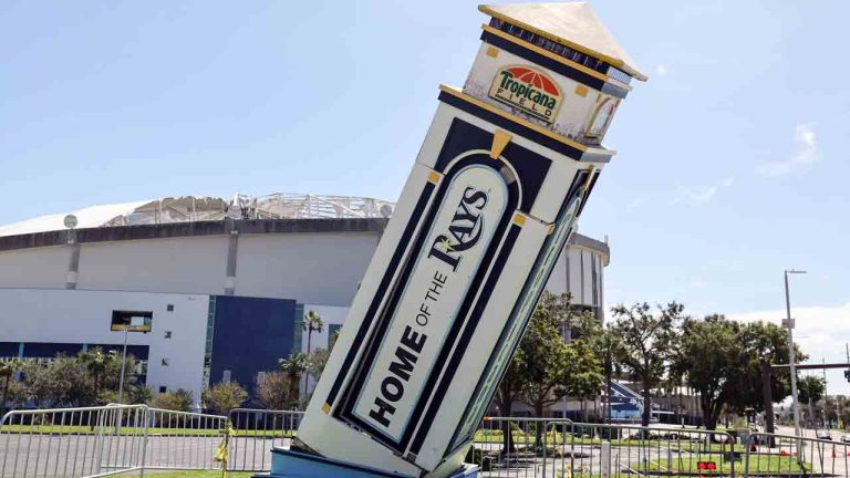 Signage and the roof of Tropicana Field damaged by winds from Hurricane Milton on Thursday, Oct. 10, 2024, in St. Petersburg, Fla. (Mike Carlson/AP)