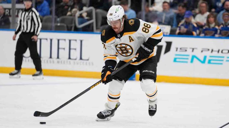 Boston Bruins' David Pastrnak handles the puck during the first period of an NHL hockey game against the St. Louis Blues Tuesday, Nov. 12, 2024, in St. Louis. (Jeff Roberson/AP)