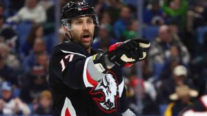 Buffalo Sabres left wing Jason Zucker (17) lines up for a faceoff during the first period of an NHL hockey game against the Vancouver Canucks Friday, Nov. 29, 2024, in Buffalo, N.Y. (Jeffrey T. Barnes/AP)