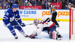 Toronto Maple Leafs centre John Tavares (91) scores a goal on Washington Capitals goaltender Charlie Lindgren (79) during second period NHL hockey action in Toronto on Friday, December 6, 2024. THE CANADIAN PRESS/Cole Burston