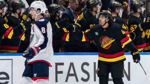 Vancouver Canucks' Kiefer Sherwood (44) celebrates his goal against the Columbus Blue Jackets during the second period of an NHL hockey game in Vancouver, on Friday, December 6, 2024. (Ethan Cairns/CP)