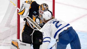 Pittsburgh Penguins goaltender Tristan Jarry (35) blocks a shot-attempt by Toronto Maple Leafs' Simon Benoit (2) during the first period of an NHL hockey game Saturday, Dec. 7, 2024, in Pittsburgh. (Gene J. Puskar/AP)