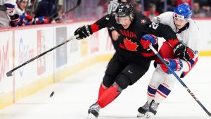 Czechia's Jakub Fibigr tries to force Canada's Easton Cowan off the puck during second period World Junior Championship hockey pre-tournament action in Ottawa, Monday, Dec. 23, 2024. (CP/Sean Kilpatrick)