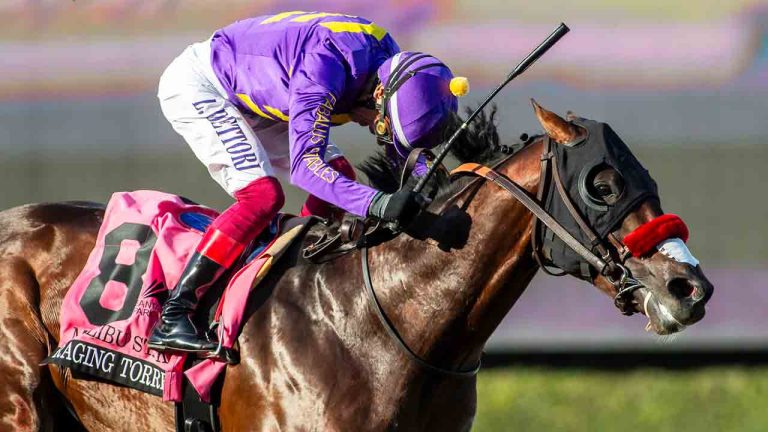 In this image provided by Benoit Photo, Raging Torrent, with Lanfranco Dettori aboard, wins the Grade I $300,000 Malibu Stakes horse race Thursday, Dec. 26, 2024, at Santa Anita Park in Arcadia, Calif. (Benoit Photo via AP)