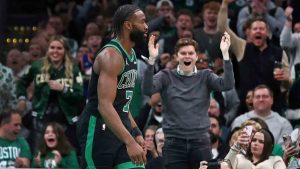 Fans react after Boston Celtics forward Jaylen Brown (7) slammed home two points during the second quarter of an NBA basketball game against the Indiana Pacers on Friday Dec. 27, 2024 in Boston. (Jim Davis/AP)