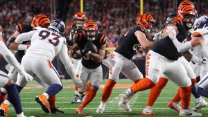 Cincinnati Bengals running back Chase Brown, centre, carries the ball during the first half of an NFL football game against the Denver Broncos, Saturday, Dec. 28, 2024, in Cincinnati. (Kareem Elgazzar/AP)