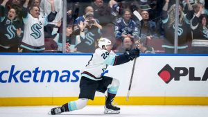 Seattle Kraken's Vince Dunn (29) celebrates his game winning goal against the Vancouver Canucks during overtime NHL hockey action in Vancouver, on Saturday, December 28, 2024. (Ethan Cairns/CP)