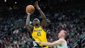 Indiana Pacers forward Pascal Siakam (43) looks to shoot at the basket in front of Boston Celtics forward Sam Hauser, right, in the first half of an NBA basketball game, Sunday, Dec. 29, 2024, in Boston. (Steven Senne/AP)