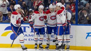 Montreal Canadiens right wing Joel Armia (40) celebrates with teammates after scoring a goal during the third period of an NHL hockey game against the Tampa Bay Lightning, Sunday, Dec. 29, 2024, in Tampa, Fla. (Mary Holt/AP)