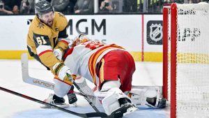 Vegas Golden Knights right wing Mark Stone (61) shoots against Calgary Flames goaltender Dan Vladar (80) during the second period of an NHL hockey game Sunday, Dec. 29, 2024, in Las Vegas. (David Becker/AP)