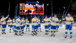 The St. Louis Blues celebrate after their win over the Chicago Blackhawks in the NHL Winter Classic outdoor hockey game at Wrigley Field, Tuesday, Dec. 31, 2024, in Chicago. (Erin Hooley/AP)