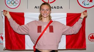 Canadian Olympic Swimmer Summer McIntosh poses for a photograph after arriving at Toronto Pearson International Airport in Mississauga, Ont., Tuesday, Aug. 6, 2024. THE CANADIAN PRESS/Arlyn McAdorey