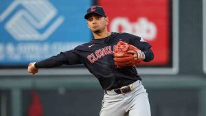 Cleveland Guardians second baseman Andrés Giménez throws to first base to put out Minnesota Twins designated hitter Matt Wallner during the sixth inning of a baseball game, Saturday, Aug. 10, 2024, in Minneapolis. Twins' Willi Castro scored on the play. (Matt Krohn/AP)