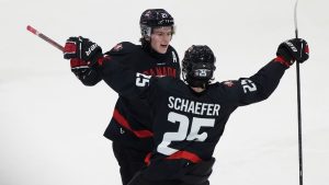 Canada forward Calum Ritchie celebrates his goal with teammate defenceman Matthew Schaefer during third period IIHF World Junior Hockey Championship pre-tournament action, Saturday, Dec.21, 2024 in Ottawa. (Adrian Wyld/CP)