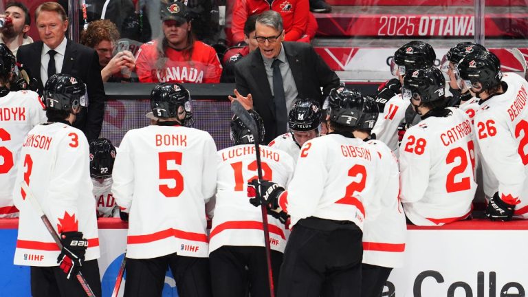 Canada head coach Dave Cameron speaks to his players during third period IIHF World Junior Hockey Championship preliminary round action against Latvia in Ottawa on Friday, Dec. 27, 2024. (Sean Kilpatrick/CP)