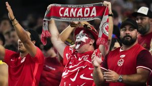 Canada fans cheer after winning a Copa America quarterfinal soccer match between Venezuela and Canada, Friday, July 5, 2024. (Julio Cortez/AP)