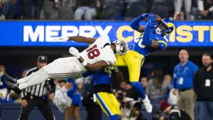 Los Angeles Rams safety Kamren Kinchens (26) intercepts a pass intended to Arizona Cardinals wide receiver Marvin Harrison Jr. (18) during an NFL football game, Saturday, Dec. 28, 2024, in Inglewood, Calif. (AP Photo/Kyusung Gong)