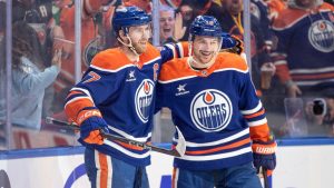 Edmonton Oilers' Connor McDavid (97) and Zach Hyman (18) celebrate a goal against the St. Louis Blues during second period NHL action in Edmonton on Saturday, December 7, 2024. (THE CANADIAN PRESS/Jason Franson)