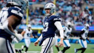 Dallas Cowboys quarterback Cooper Rush celebrates after a touchdown by wide receiver Jalen Tolbert during the second half of an NFL football game against the Carolina Panthers, Sunday, Dec. 15, 2024, in Charlotte, N.C. (Jacob Kupferman/AP)