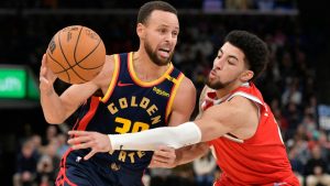 Golden State Warriors guard Stephen Curry (30) drives against Memphis Grizzlies guard Scotty Pippen Jr., right, in the first half of an NBA basketball game Thursday, Dec. 19, 2024, in Memphis, Tenn. (Brandon Dill/AP)