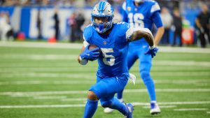 Detroit Lions running back David Montgomery (5) rushes against the Green Bay Packer during an NFL football game in Detroit, Thursday, Dec. 5, 2024. (Rick Osentoski/AP)