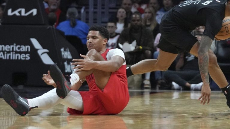 Miami Heat guard Dru Smith, left, loses control of the ball as Brooklyn Nets guard Keon Johnson recovers the ball during the first half of an NBA basketball game, Monday, Dec. 23, 2024, in Miami. (Lynne Sladky/AP)