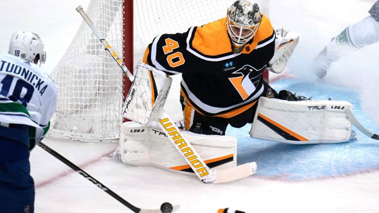 Winnipeg Jets center Kevin Stenlund (28) can't get off a shot in front of Pittsburgh Penguins goaltender Dustin Tokarski (40) during the first period of an NHL hockey game, Friday, Jan. 13, 2023. (Gene J. Puskar/AP)