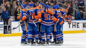 The Edmonton Oilers celebrate their overtime win against the Boston Bruins in Edmonton on Thursday, December 19, 2024. (Timothy Matwey/CP)