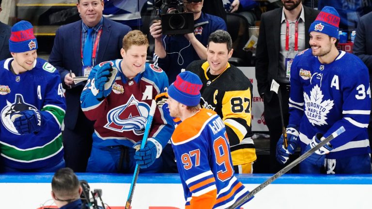 Edmonton Oilers' Connor McDavid is congratulated by Vancouver Canucks' Elias Pettersson, left to right, Colorado Avalanche's Nathan MacKinnon, Pittsburgh Penguins' Sidney Crosby and Toronto Maple Leafs' Auston Matthews after winning the NHL All-Star skills competition in Toronto, Friday, Feb. 2, 2024. (Frank Gunn/CP)