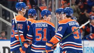 Edmonton Oilers' Darnell Nurse (25), Connor Brown (28), Troy Stecher (51), Connor McDavid (97) and Ryan Nugent-Hopkins (93) celebrate a goal against the Utah Hockey Club during second period NHL action in Edmonton on Tuesday, December 31, 2024. (Jason Franson/CP)