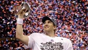 New York Giants quarterback Eli Manning holds up the Vince Lombardi Trophy while celebrating his team's 21-17 win over the New England Patriots in the NFL Super Bowl XLVI football game, Feb. 5, 2012, in Indianapolis. (David J. Phillip/AP)
