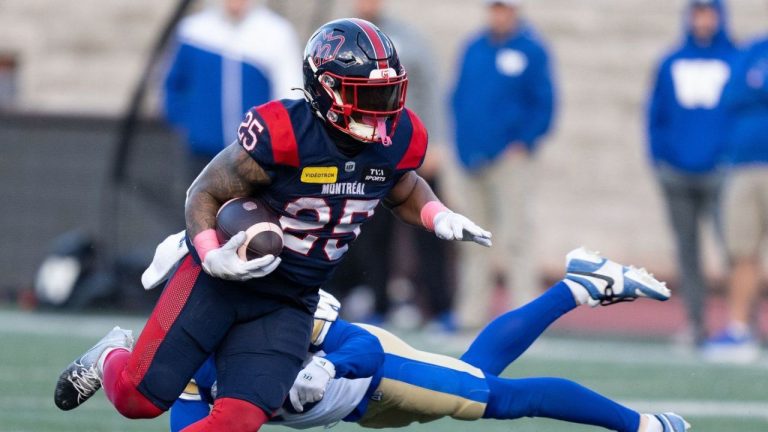 Montreal Alouettes running back Walter Fletcher (25) evades a tackle by Winnipeg Blue Bombers defensive back Jake Kelly (16) during CFL football action in Montreal on Saturday, Oct. 26, 2024. (Christinne Muschi/CP)