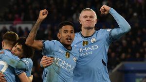 Manchester City's Erling Haaland, right, celebrates with Manchester City's Savinho after scoring his side's second goal during the English Premier League soccer match between Leicester City and Manchester City at King Power stadium in Leicester, England, Sunday, Dec. 29, 2024. (Rui Vieira/AP)