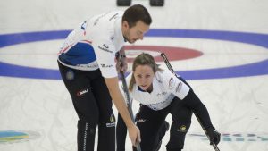 Rachel Homan and playing partner Brendan Bottcher compete against Jessica Zheng and Victor Pietrangelo during draw 5 action against at the Canadian mixed doubles curling trials in Liverpool, N.S. on Tuesday, Dec.31, 2024. (Michael Burns/CP)