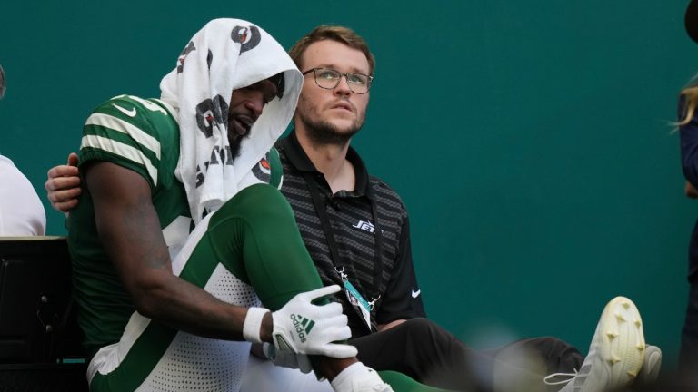 New York Jets wide receiver Irvin Charles is taken off the field after an injury during the second half of an NFL football game against the Miami Dolphins, Sunday, Dec. 8, 2024, in Miami Gardens, Fla. (Lynne Sladky/AP)