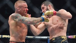 Islam Makhachev, right, punches Dustin Poirier, during the third round of a lightweight title bout at UFC 302. (Frank Franklin II/AP)