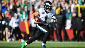 Philadelphia Eagles quarterback Jalen Hurts runs with the ball during the first half of an NFL game against the Washington Commanders, Sunday, Dec. 22, 2024, in Landover, Md. (AP/Nick Wass)