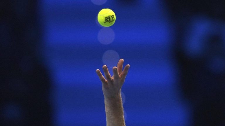 Italy's Jannik Sinner serves the ball to Russia's Daniil Medvedev during their singles tennis match of the ATP World Tour Finals. (Antonio Calanni/AP)