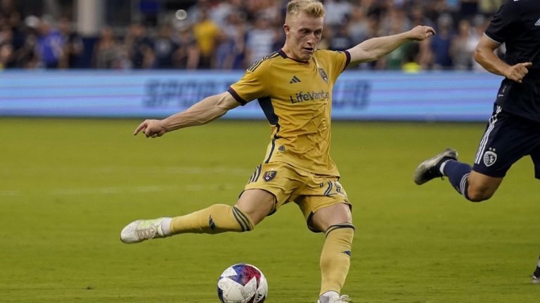 Real Salt Lake defender Jasper Löffelsend kicks the ball during the first half of an MLS match against Sporting Kansas City Wednesday, July 12, 2023, in Kansas City, Kan. (AP/Charlie Riedel)